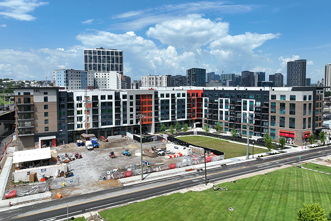 Modern apartment complex under construction with new, modern windows