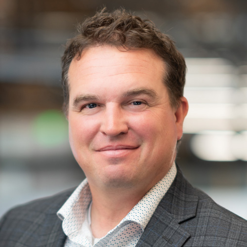 Philip Wentworth, man in plaid blazer and dotted shirt