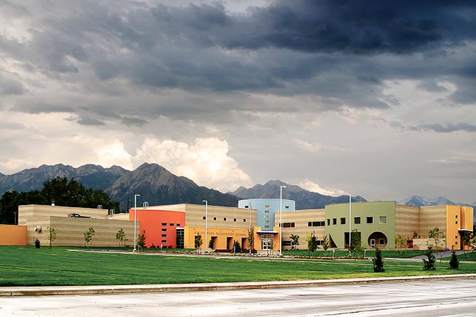 Colorful school building against mountains