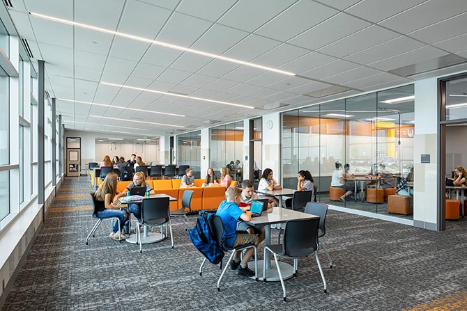 Modern classroom with students studying.